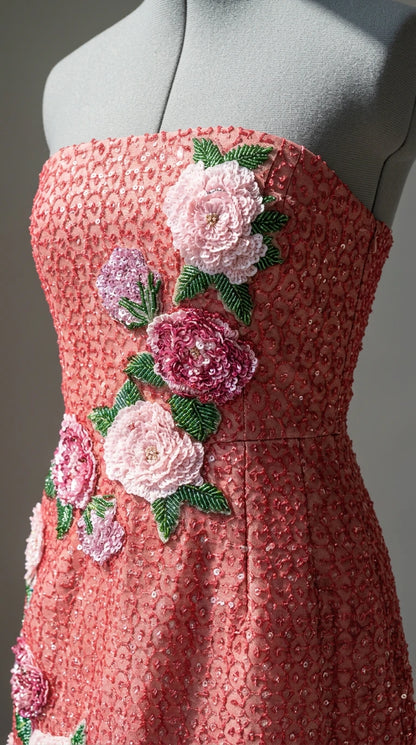 Close-up detail of floral appliques and beadwork