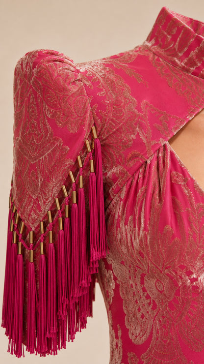 Close up of sleeve fringe and bead details on Hot Pink dress