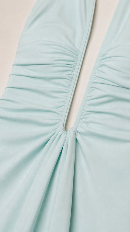 Close-up detail of gathered fabric and neckline