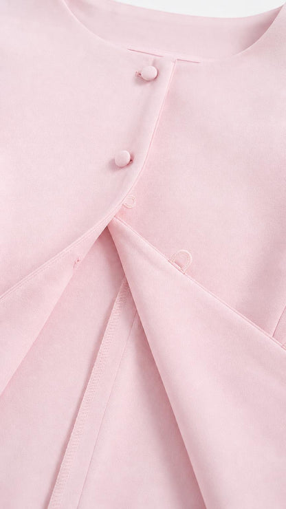 Close-up of pink top buttons and fabric detail
