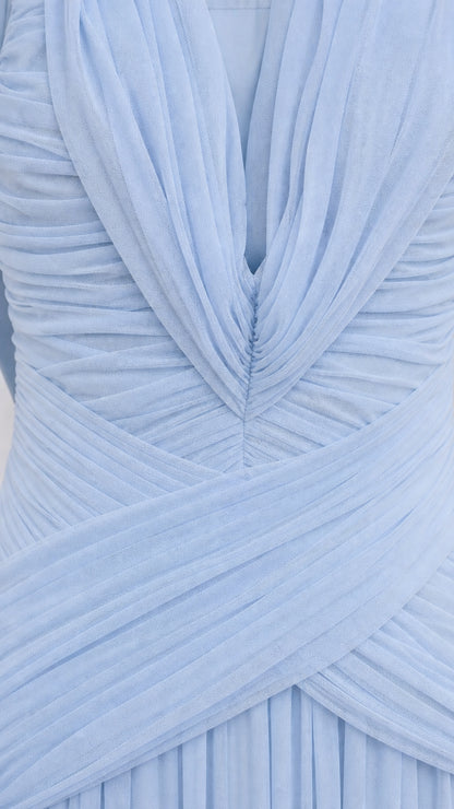 Close-up detail of pleated bodice and V-neckline