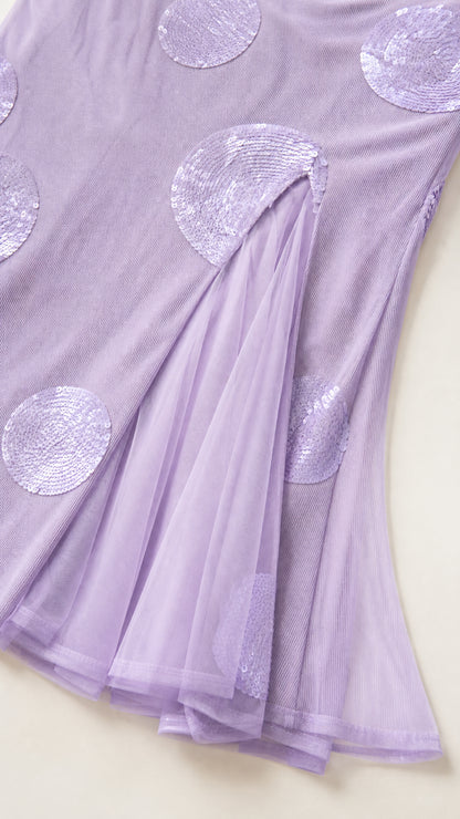 Close-up detail of sequin polka dots on mesh hem