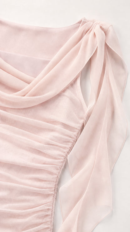 Close-up detail of draped cowl neckline and shoulder ruffles