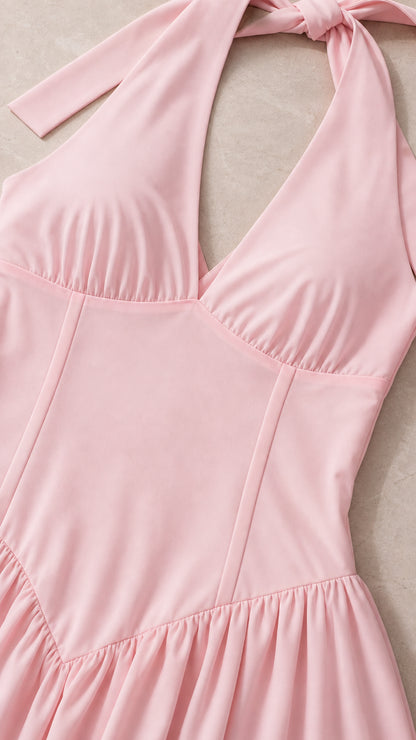 Close-up detail of halter neck and bodice on pink dress