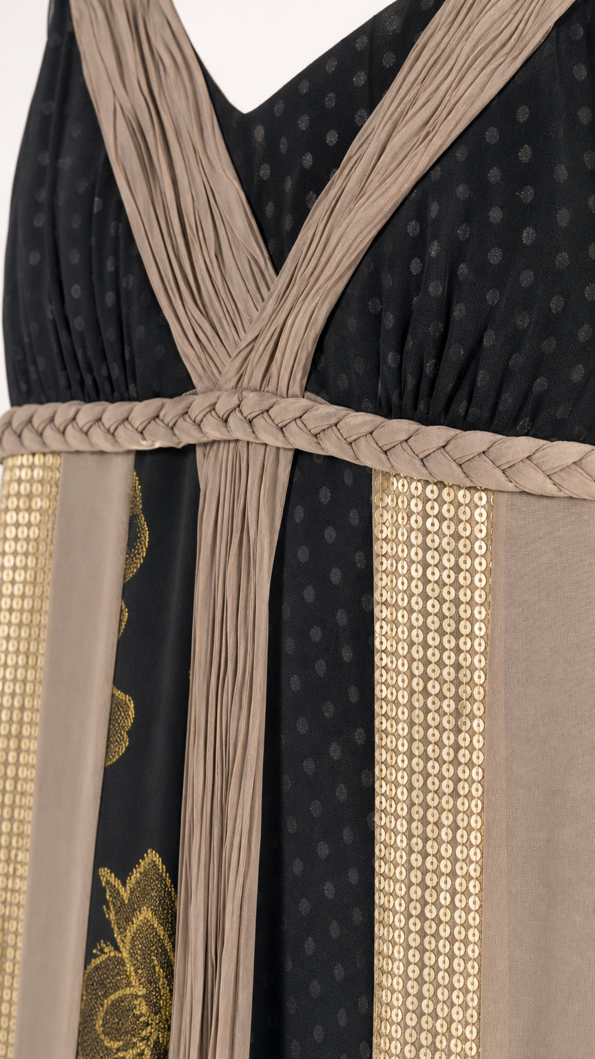 Close-up detail of pleated bodice and braided waist on maxi dress