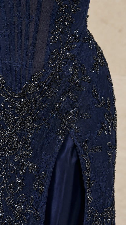Close-up of intricate beadwork and high slit on Navy dress
