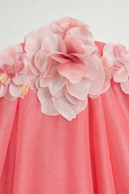 Close-up detail of 3D fabric flower appliques on dress neckline