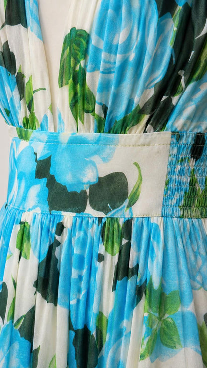 Close-up detail of pleated bodice and elastic waistband on floral dress
