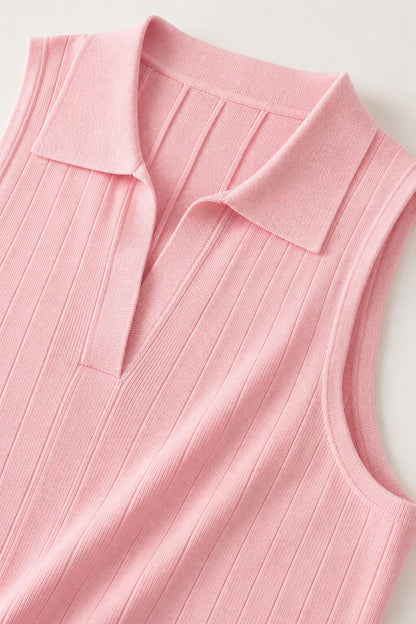 Close-up detail of the polo collar and ribbed texture on pink knit dress