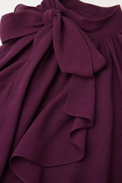 Close up of purple shoulder bow and chiffon fabric texture