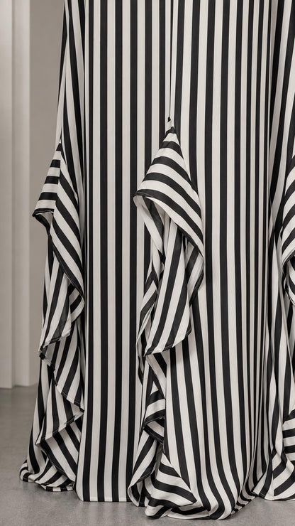 Close-up of bottom ruffle hem on striped maxi dress