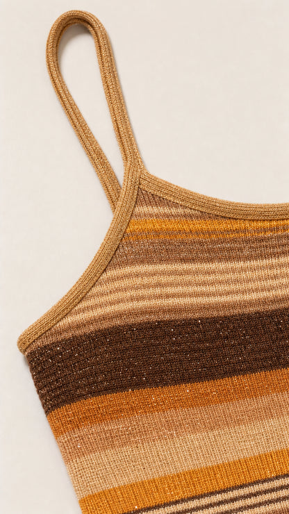Close-up detail of strap and knit texture on camel dress