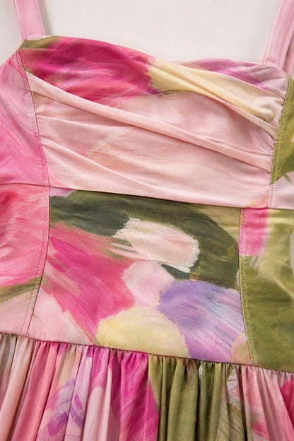 Close-up detail of pleated bust and watercolor floral fabric pattern