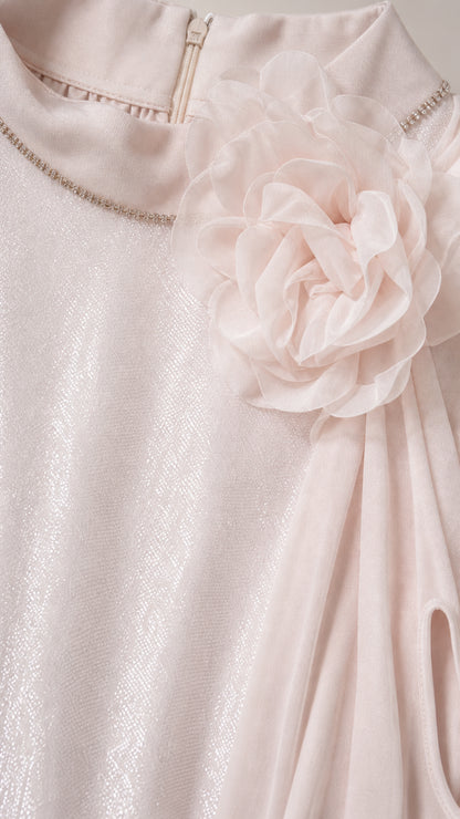 Close-up detail of the mock neckline, rhinestone trim, and 3D floral appliqué
