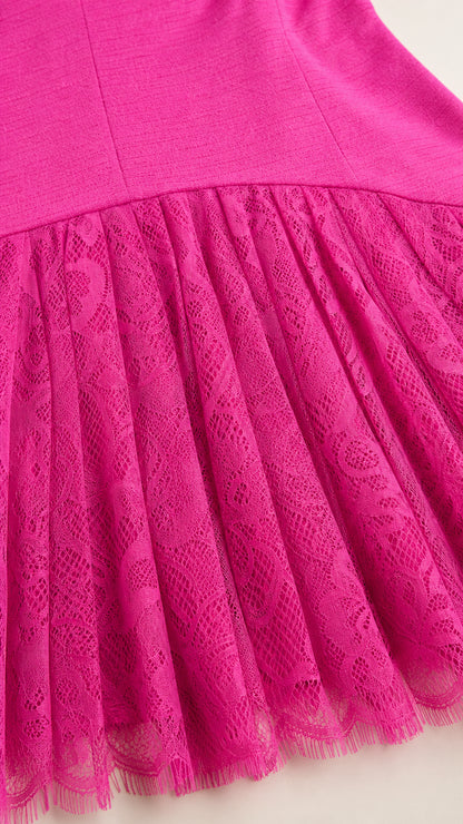 Close-up detail of fuchsia pleated lace skirt hem
