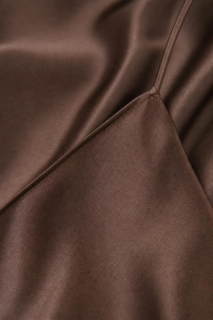 Close-up detail of smooth satin fabric and stitching