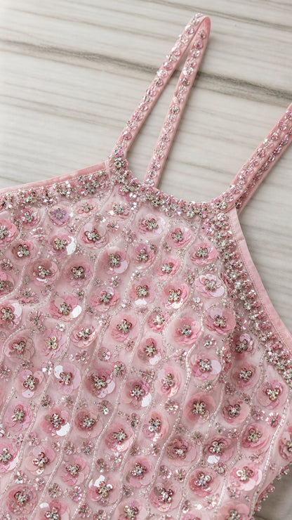 Close-up detail of halter neckline, straps, and sequin beadwork