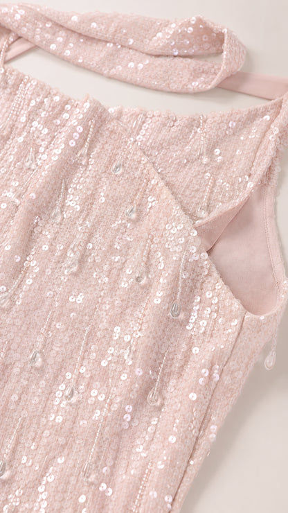 Close-up of sequin fabric texture and neckline construction