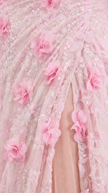 Close-up detail of pink 3D floral appliques and mesh fabric