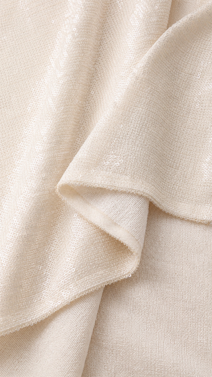 Close-up detail of smooth shimmering champagne fabric texture