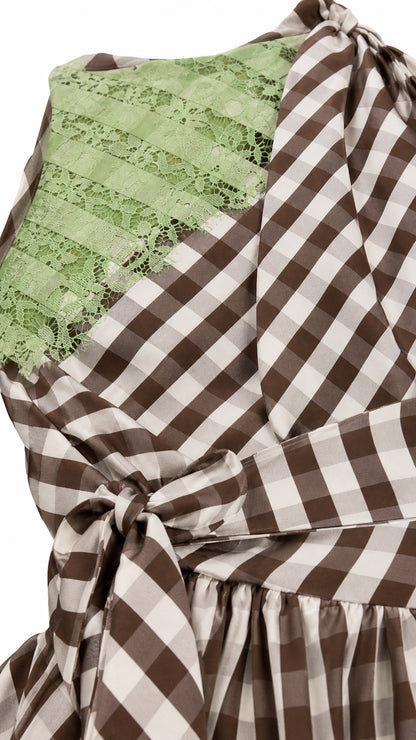 Close up of shoulder lace panel and gingham pattern
