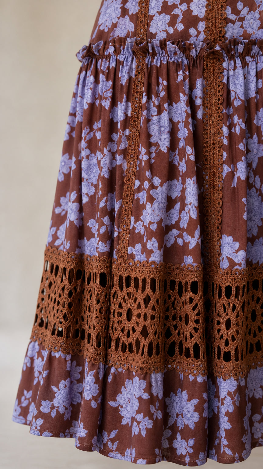 Close-up detail of crochet lace border and floral print hem