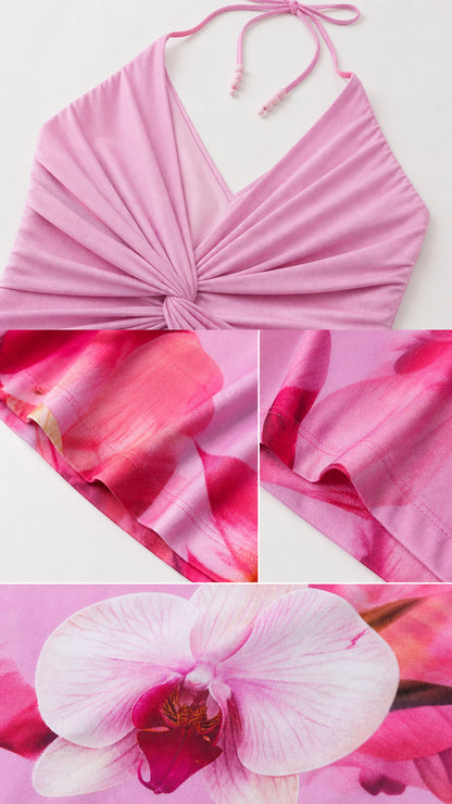 Close up of halter neck, twist front bodice, and floral fabric texture