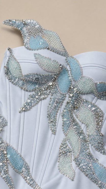 Close-up detail of crystal beaded leaf appliqué on bodice