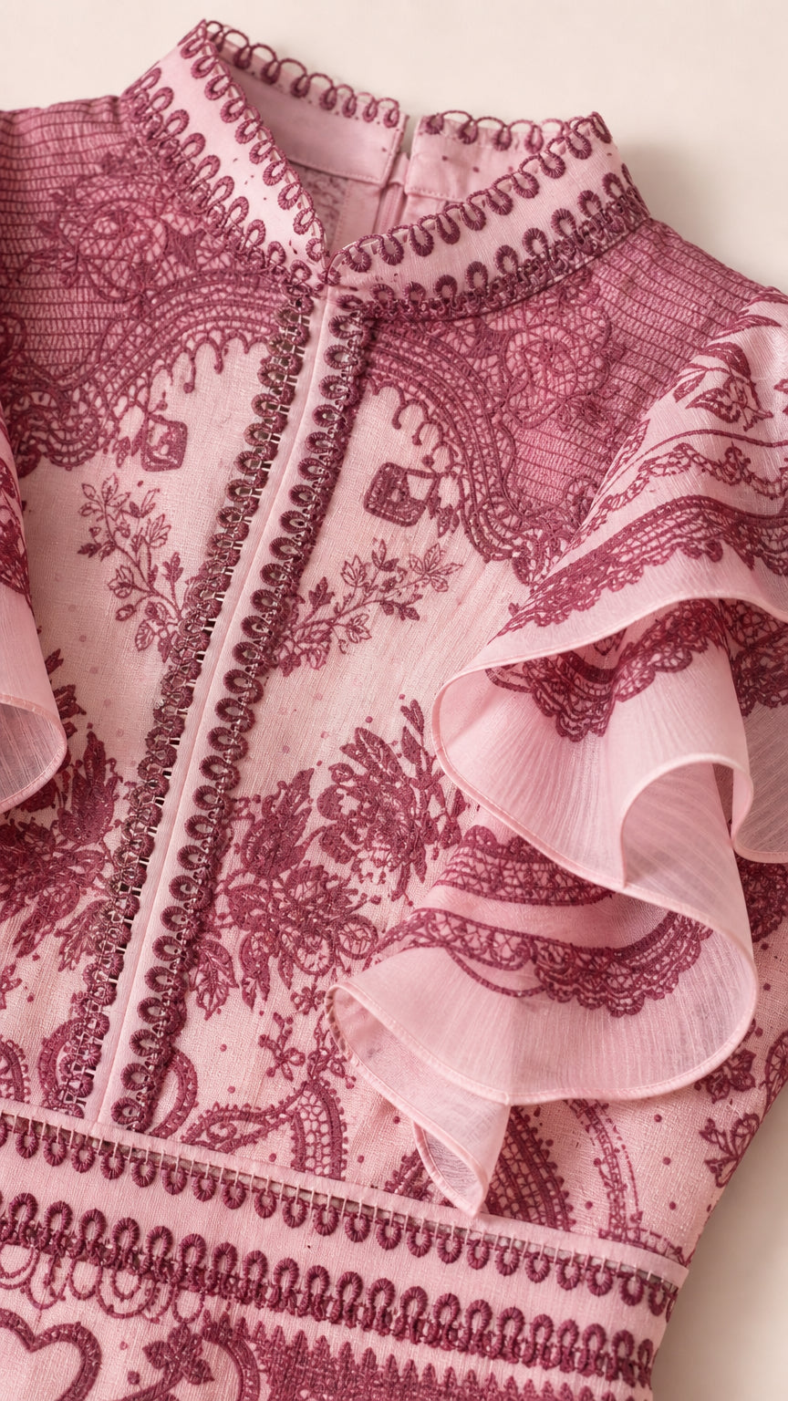 Close-up detail of stand collar and ruffle shoulder trim