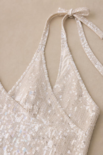 Close-up detail of white sequin halter neckline and straps