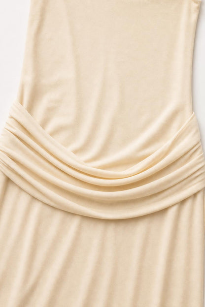 Close-up detail of the waist draping on the Champagne dress