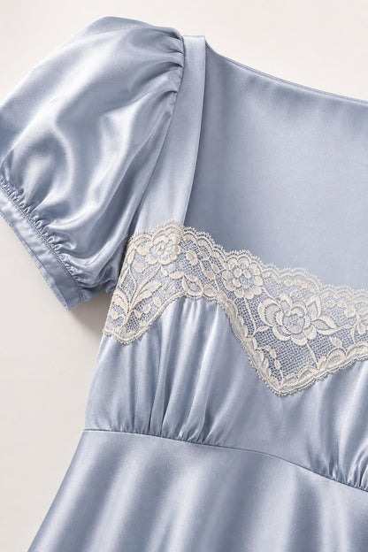 Close-up detail of square neck and lace bodice on light blue satin dress