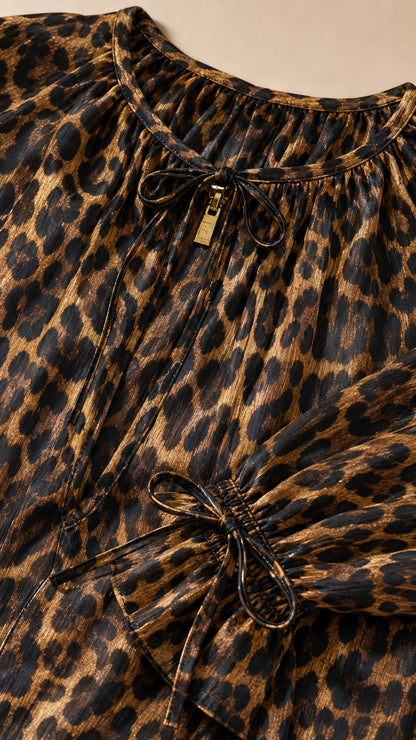 Close up of neckline tie and fabric detail of leopard print dress