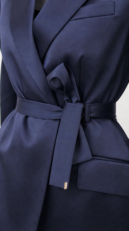 Close-up of navy satin blazer lapel and tie belt detail