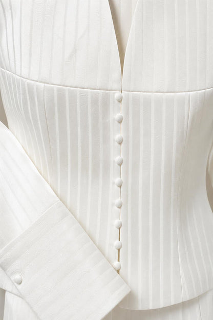Close-up of jacket buttons and pinstripe texture