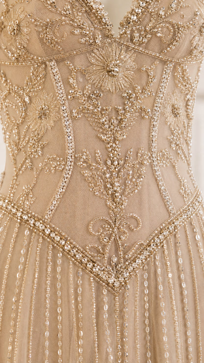 Close-up detail of intricate bodice beadwork and embroidery