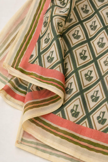 Close up of green geometric patterned fabric with contrast border