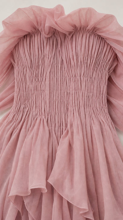 Close-up detail of smocked bodice and ruffled neckline
