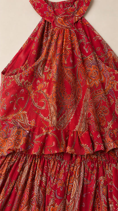 Close-up detail of the red paisley fabric and ruffle bodice
