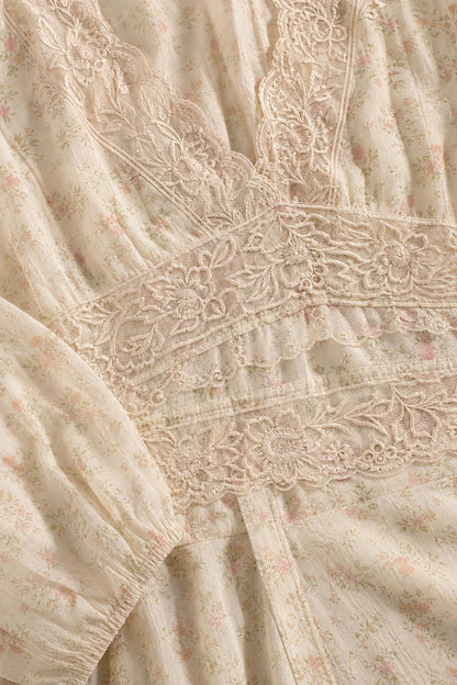Close-up detail of bodice with lace inserts and floral pattern