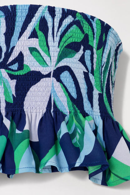 Close-up detail of smocked bandeau top texture and print