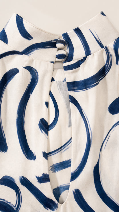 Close-up detail of high mock neckline and button closure