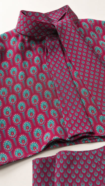 Close-up fabric and collar detail of berry patterned top