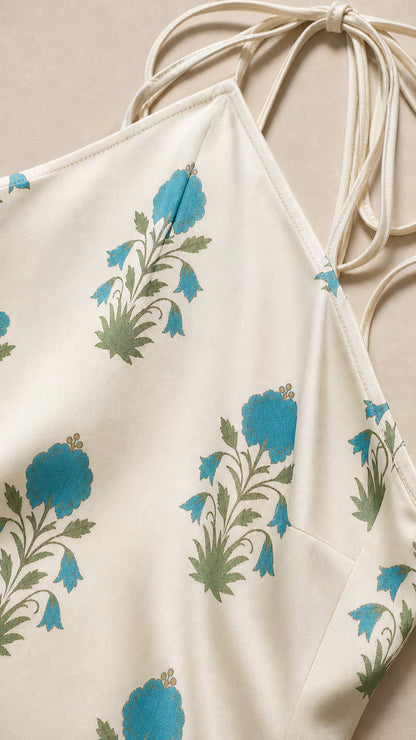 Close-up detail of blue floral pattern on white fabric