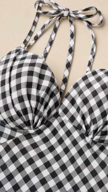 Close-up detail of sweetheart neckline and tie straps on gingham dress
