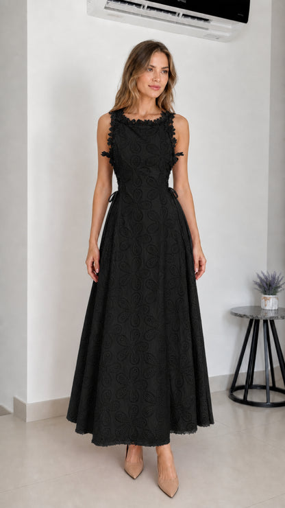 Model wearing black embroidered eyelet maxi dress