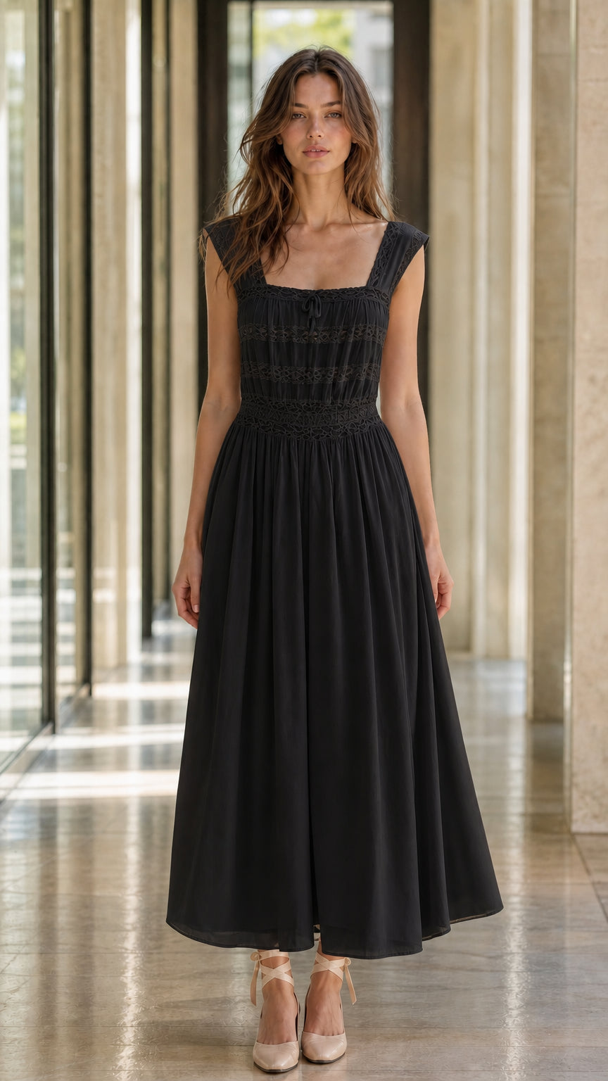 Front view of model wearing black midi dress