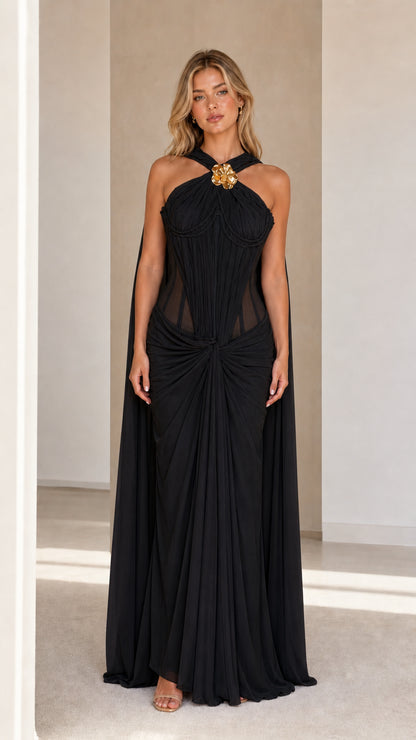 Model wearing black evening cape maxi dress