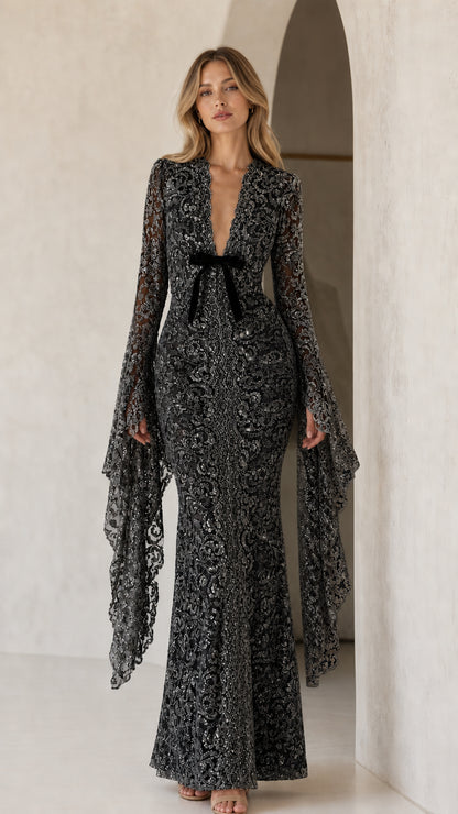 Model wearing black sequin lace maxi dress