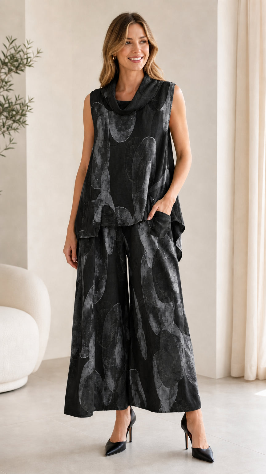 Front view of black abstract print two-piece set on model